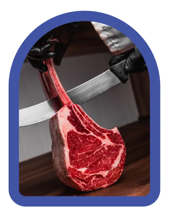 Butcher cutting Angus beef